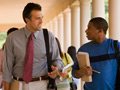 teacher and student walking and talking together