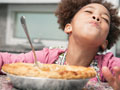 child eating pie