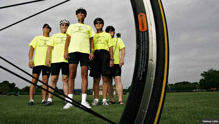 cyclist pedaling to raise money for cancer research