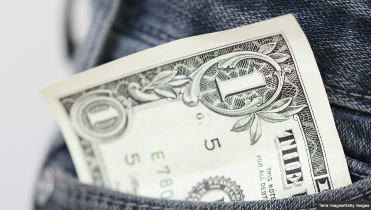 money sticking out of jeans pocket