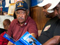 Lawrence McRae chatting in a barbershop about prostate health