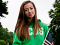 young girl holding an American flag