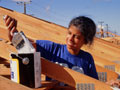 woman doing volunteer painting for 'Habitats for Humanity'