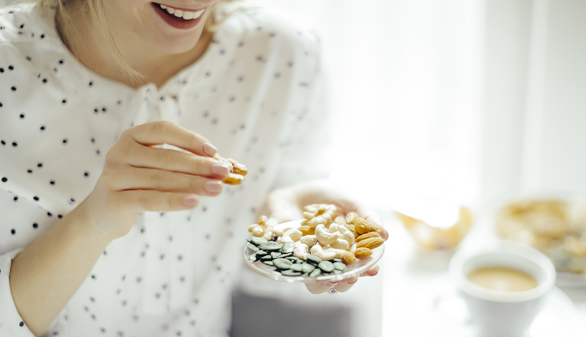 woman eating healthy snacks woman eating healthy snacks