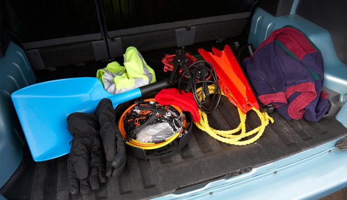 winter emergency equipment in the trunk of a car