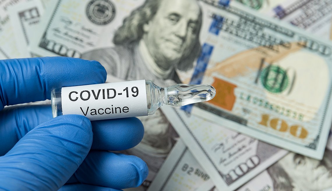 Coronavirus vaccine vial with gloves and money in the background