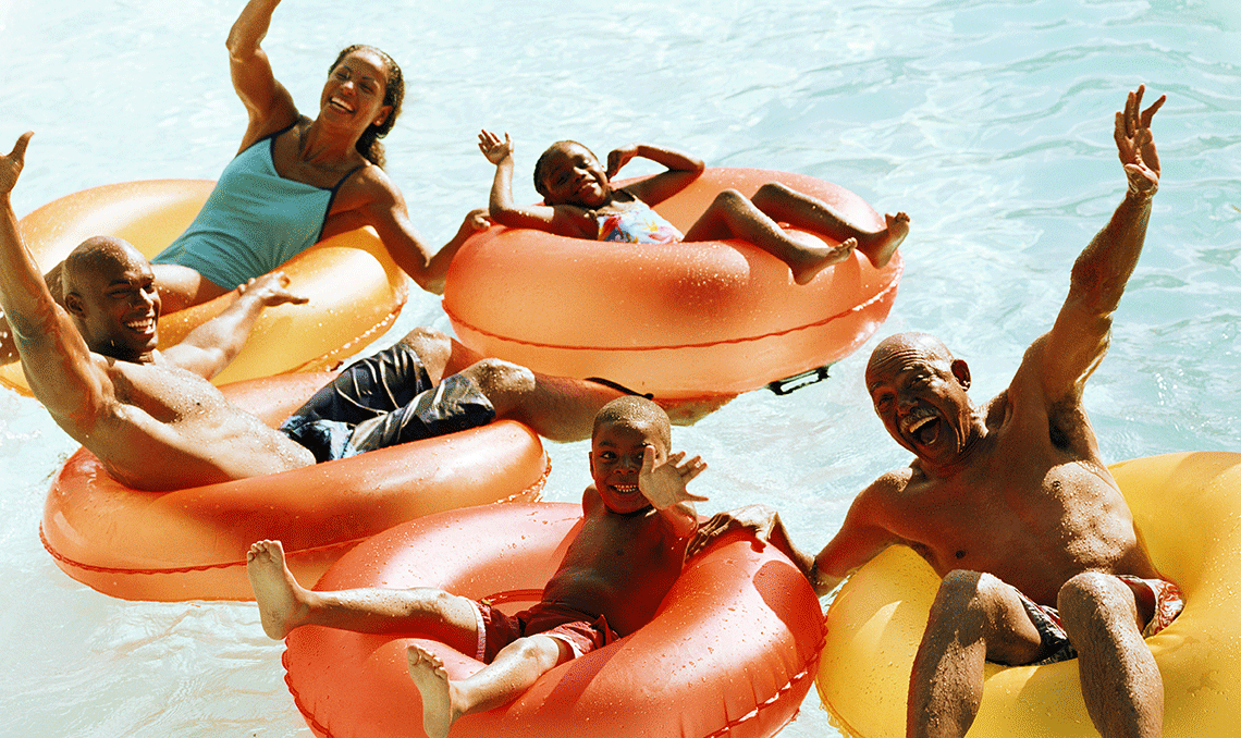 a family sitting in inner tubes in a pool a family sitting in inner tubes in a pool