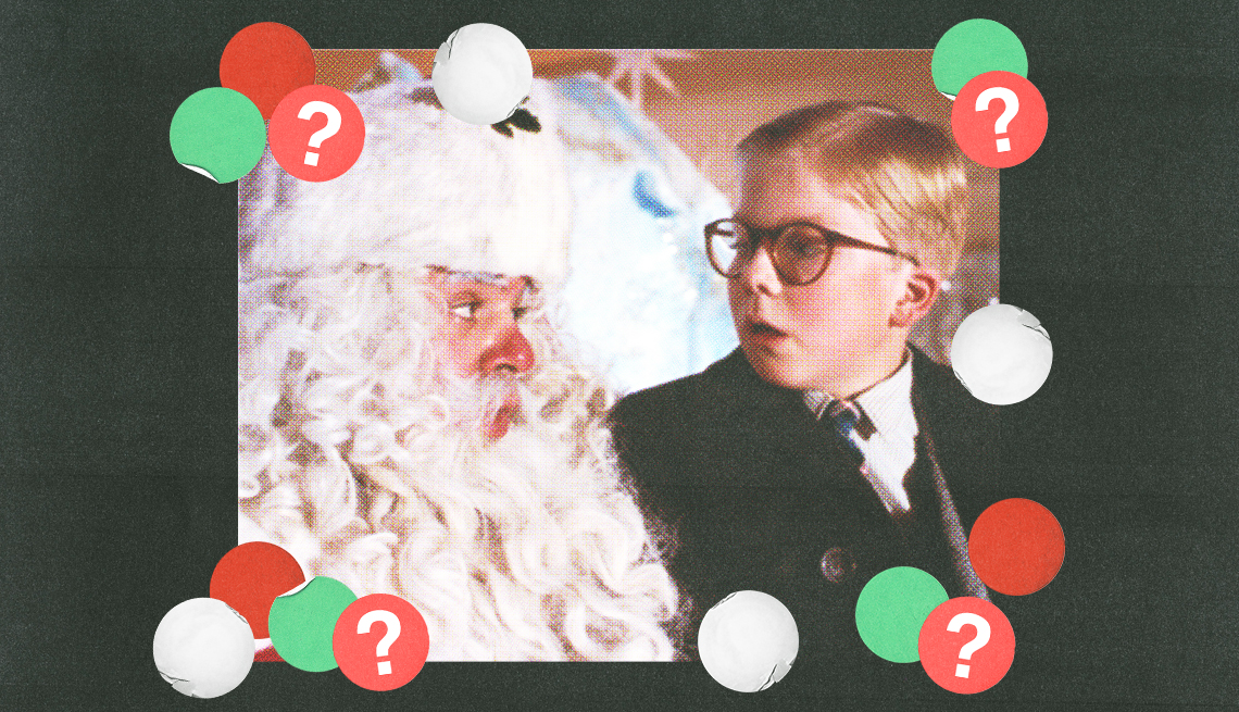 still from a christmas story of boy sitting on santa's lap and looking at him; red, green and white circles with question marks surround them; black background