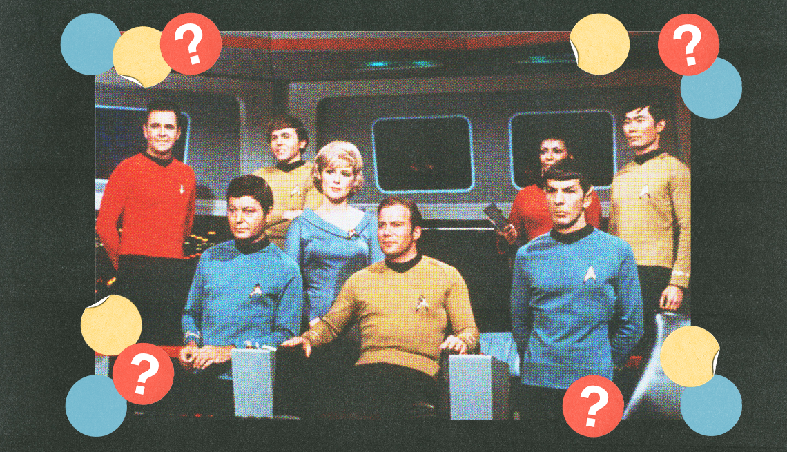 eight star trek cast members in still from the show; blue, yellow and red circles with question marks surround them eight star trek cast members in still from the show; blue, yellow and red circles with question marks surround them