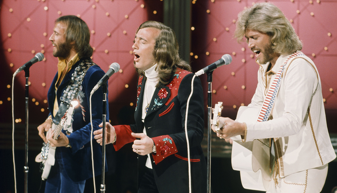 the bee gees perform on stage