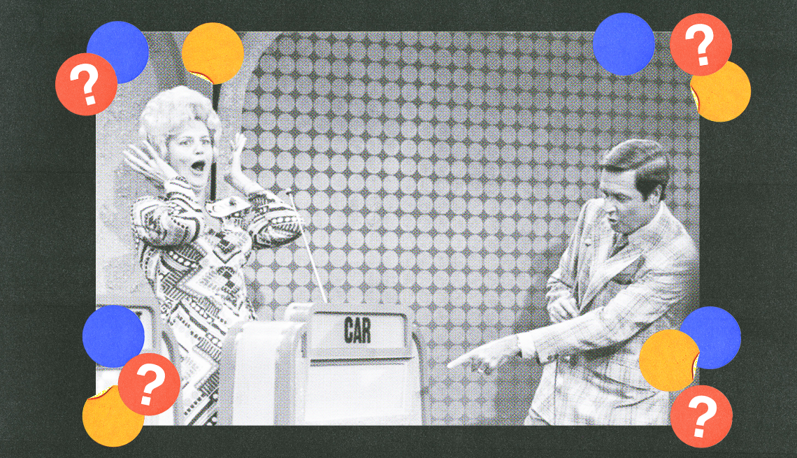 woman with mouth open and hands on sides of head behind podium that says car; man in front of podium pointing at it; blue, yellow and red circles with question marks surround them