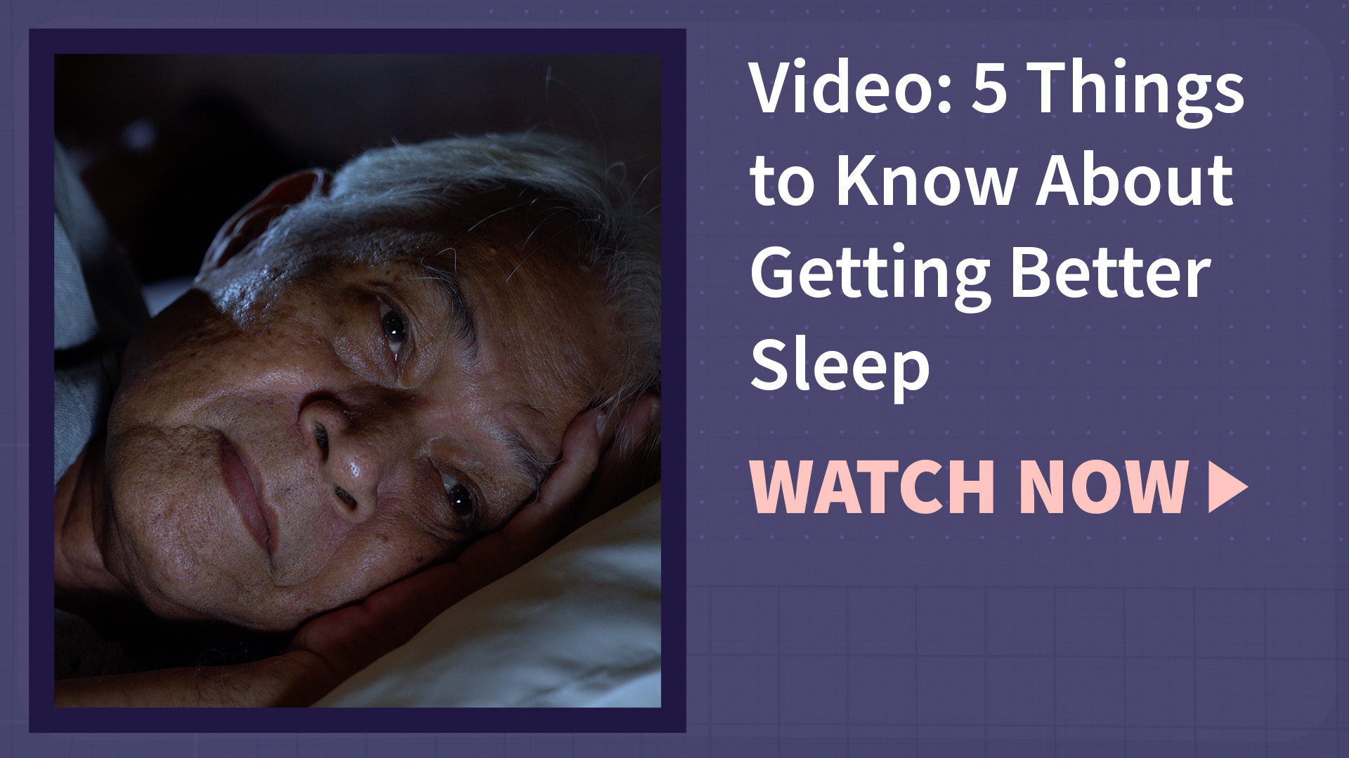 A man wide awake in a bed in a dark room