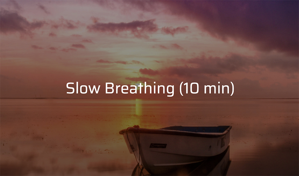 A small boat on calm water at sunset