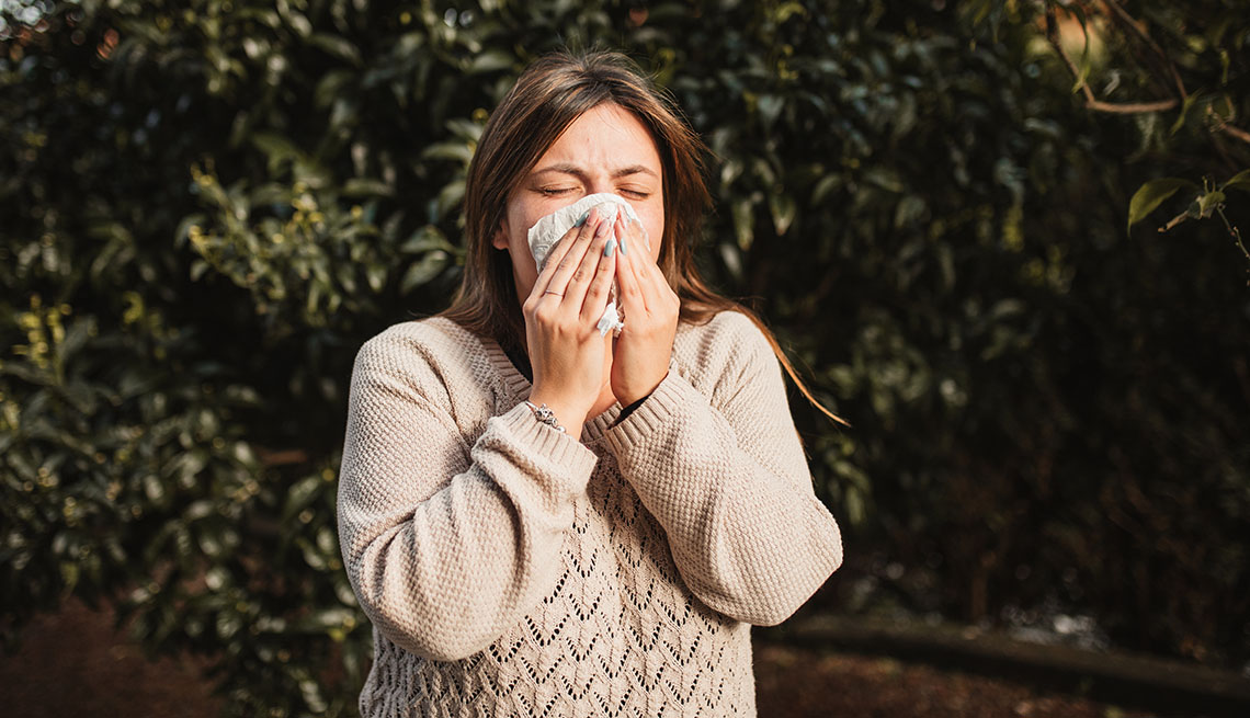 adult woman in a nature suffering allergies adult woman in a nature suffering allergies