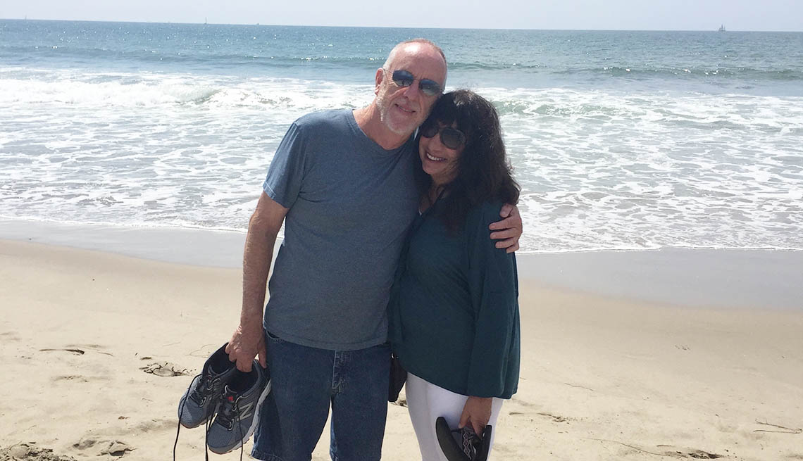 Ann Brenoff with her partner on the beach