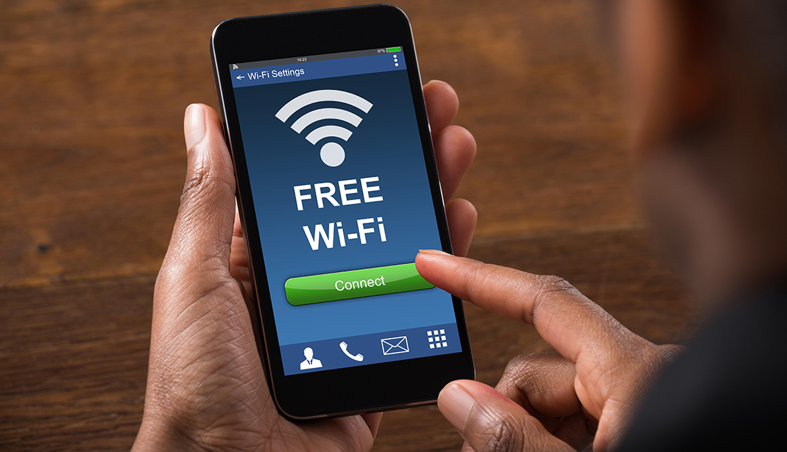 Close-up of Businessman Connecting To WiFi With Mobile Phone Close-up of Businessman Connecting To WiFi With Mobile Phone