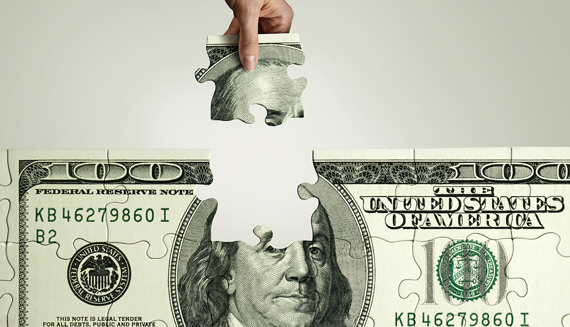 Rompecabezas de un billete de 100 dólares al que se le extrae una parte