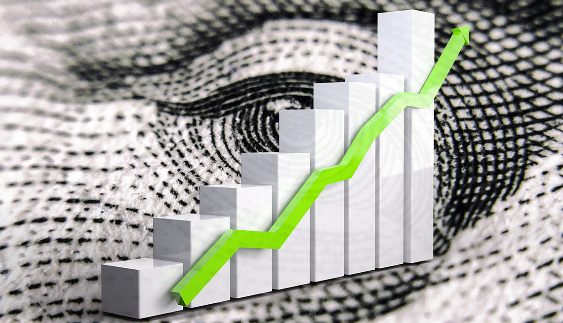 Gráfica estadística a la alza sobre un billete de dólar